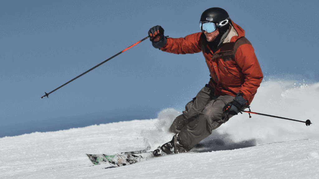 Esquiador executando manobra arrojada nas pistas nevadas dos Andes chilenos, representando o perfil técnico de estações como La Parva.